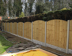 Bowtop Vertilap Fence with concrete posts & gravel boards