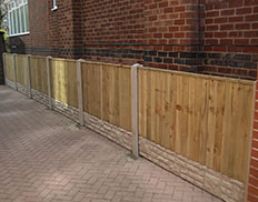 Vertilap Fence with concrete posts & gravel boards